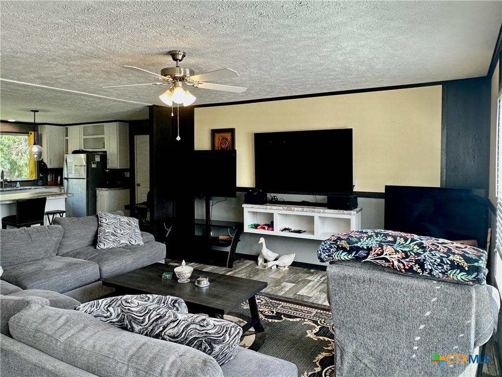 815 Track Road Dale, TX 78616 - Photo 2 of 21 a living room with furniture and a flat screen tv
