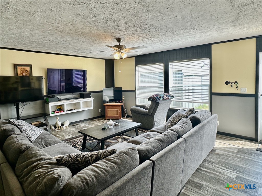 815 Track Road Dale, TX 78616 - Photo 3 of 21 a living room with furniture and a flat screen tv