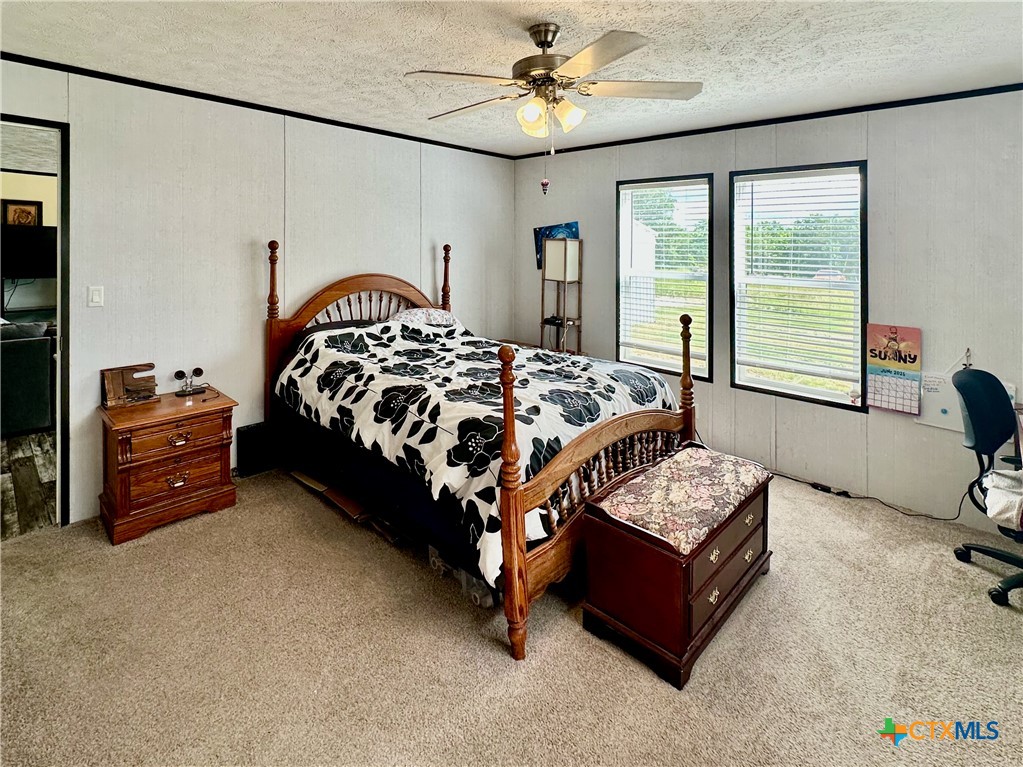 815 Track Road Dale, TX 78616 - Photo 10 of 21 a bedroom with a bed dresser and a window