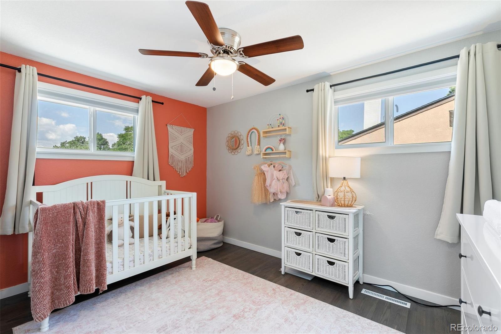 2023 Winston Road Colorado Springs, CO 80909 - Photo 11 of 39 a view of a bedroom with furniture and a window