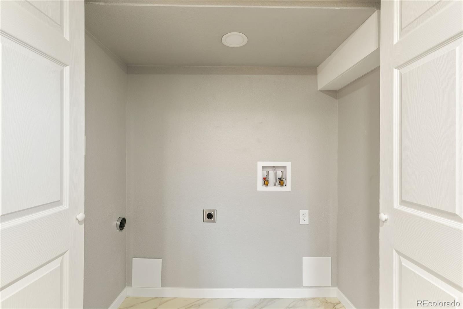 2023 Winston Road Colorado Springs, CO 80909 - Photo 14 of 39 a bathroom with a bathtub