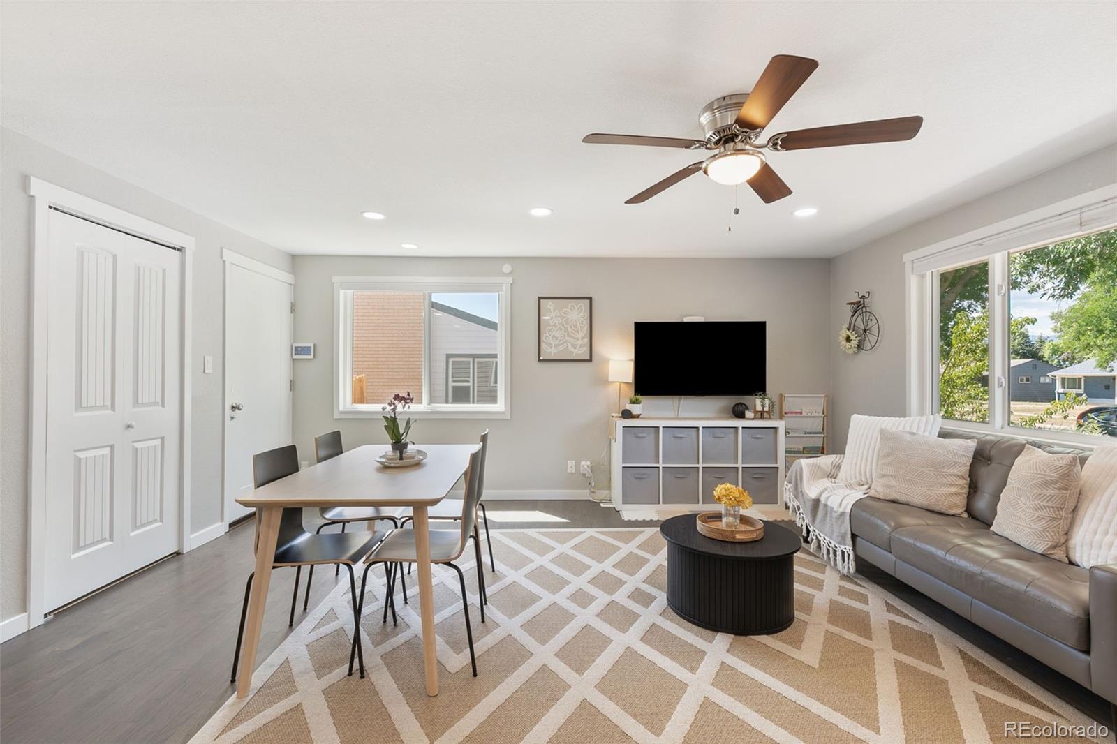 2023 Winston Road Colorado Springs, CO 80909 - Photo 15 of 39 a living room with furniture and a flat screen tv