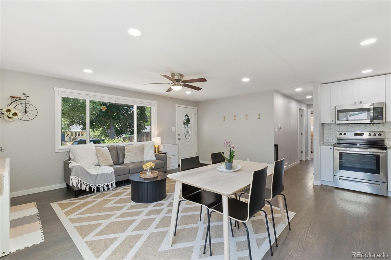 2023 Winston Road Colorado Springs, CO 80909 - Photo 16 of 39 a view of a dining room with furniture window and outside view