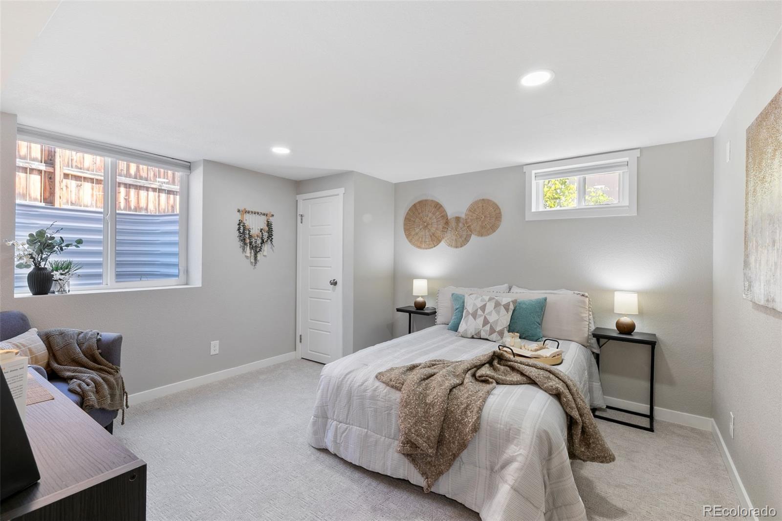 2023 Winston Road Colorado Springs, CO 80909 - Photo 22 of 39 a bedroom with bed and a window