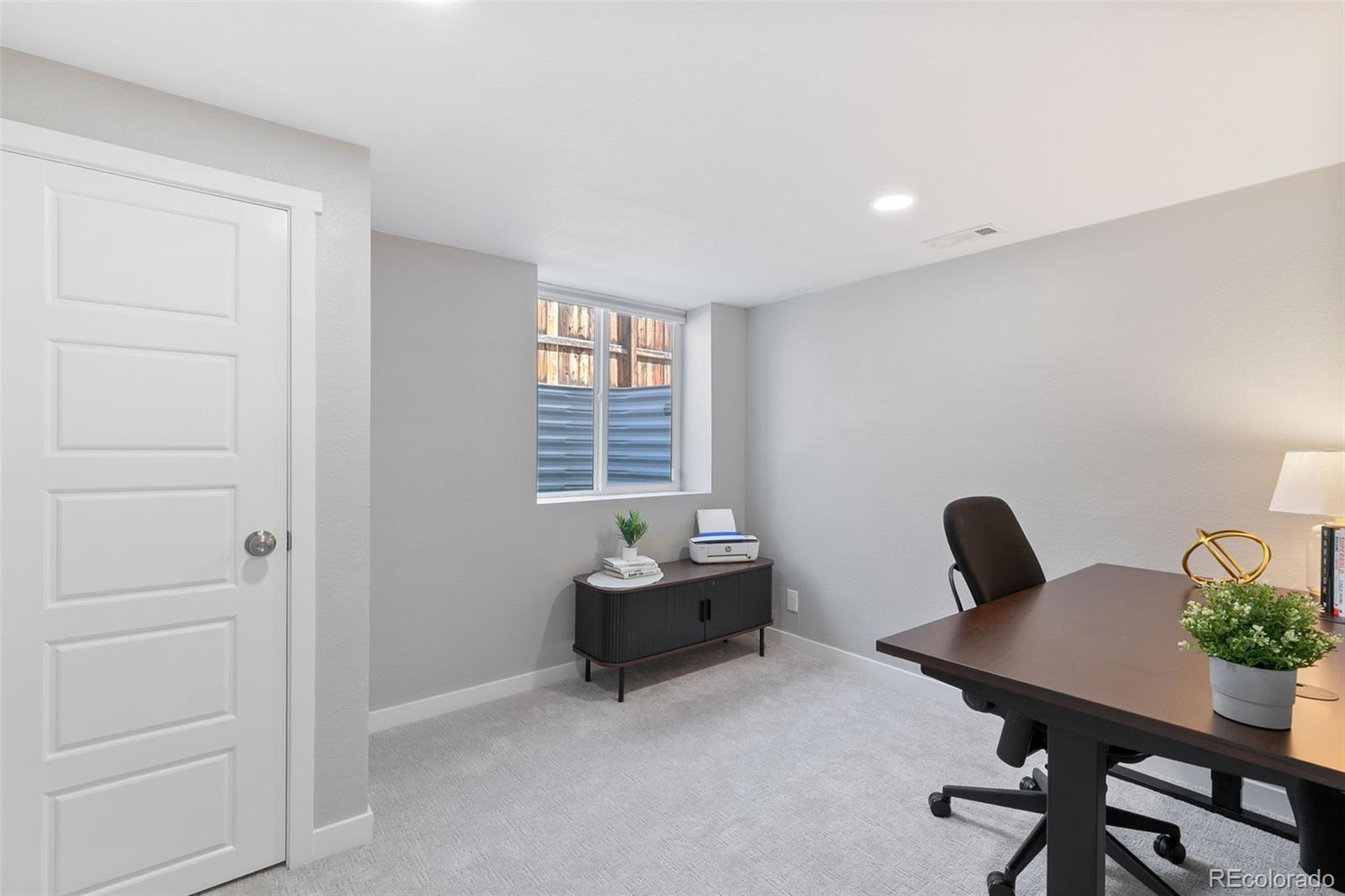2023 Winston Road Colorado Springs, CO 80909 - Photo 29 of 39 a dining room with furniture and window