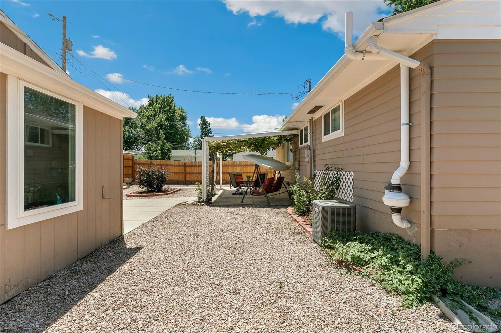 2023 Winston Road Colorado Springs, CO 80909 - Photo 37 of 39 a view of a porch with furniture and cars parked