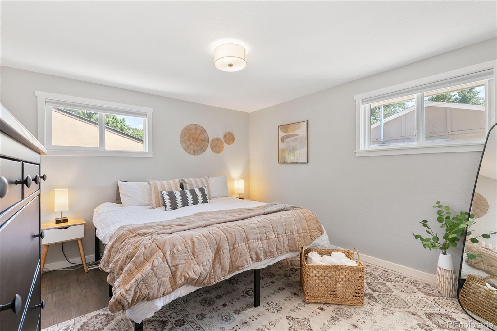 2023 Winston Road Colorado Springs, CO 80909 - Photo 7 of 39 a bedroom with a bed and window