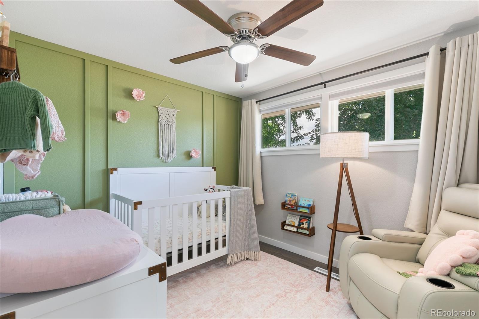 2023 Winston Road Colorado Springs, CO 80909 - Photo 9 of 39 a bedroom with furniture and a window
