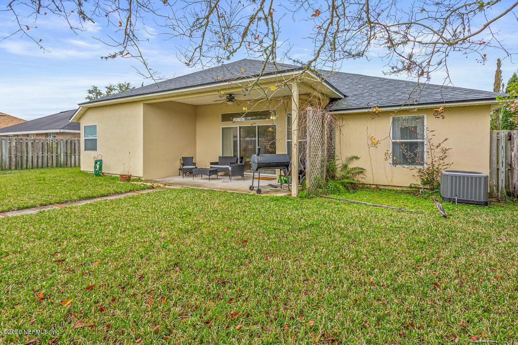 2443 Paris Mill Road Jacksonville, FL 32221 - Photo 33 of 33 a view of a house with backyard porch and sitting area
