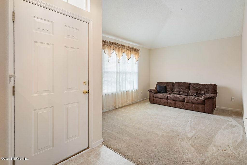 2443 Paris Mill Road Jacksonville, FL 32221 - Photo 7 of 33 a living room with furniture and a window