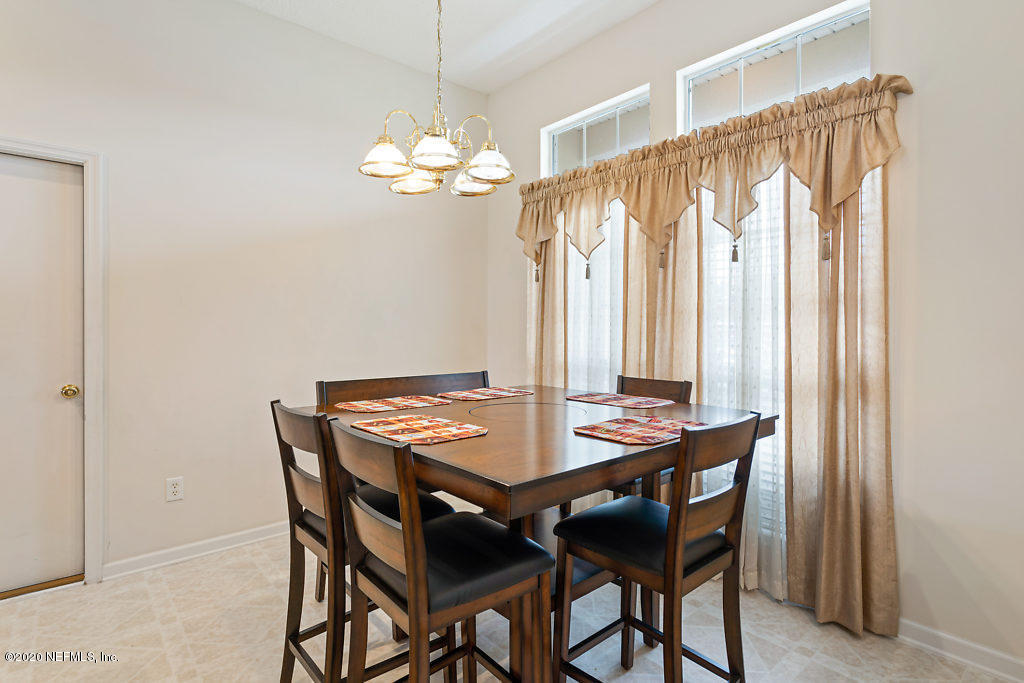 2443 Paris Mill Road Jacksonville, FL 32221 - Photo 8 of 33 a view of a dining room with furniture and window