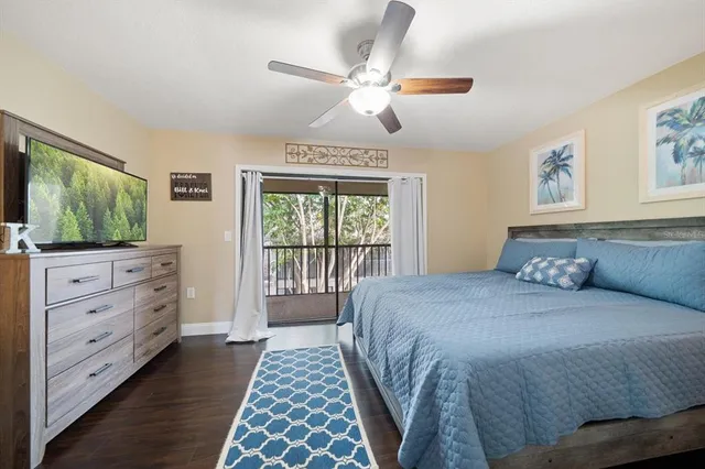 a view of a workspace with furniture and wooden floor