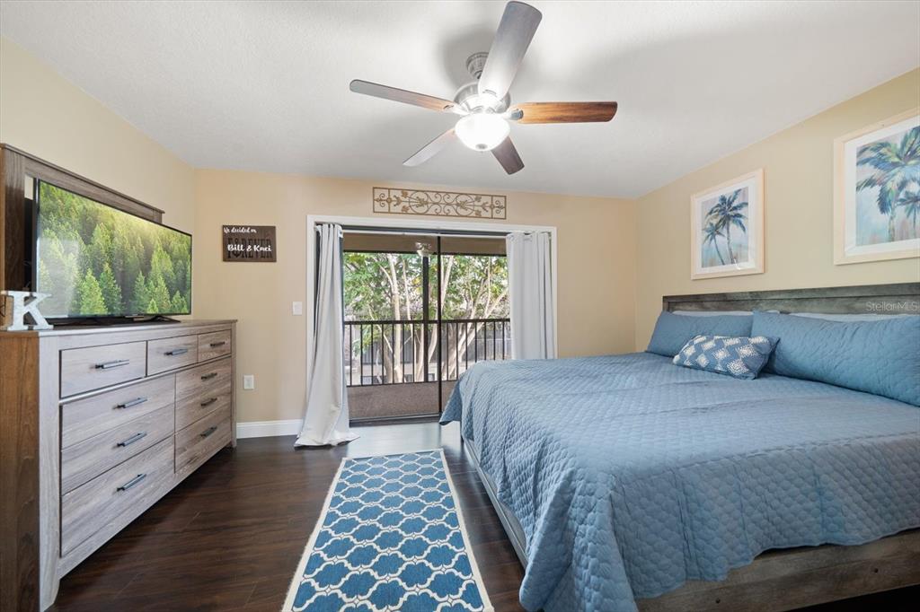 2131 Ridge Road South, Unit 75 Largo, FL 33778 - Photo 18 of 32 a bedroom with a bed and a flat screen tv