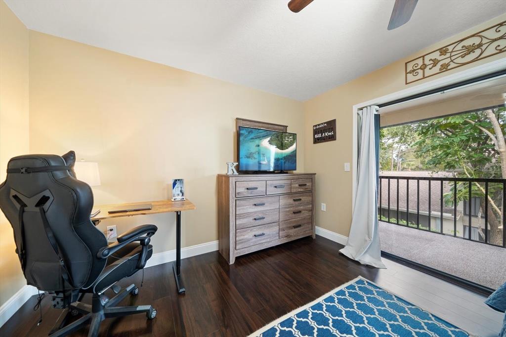 2131 Ridge Road South, Unit 75 Largo, FL 33778 - Photo 19 of 32 a view of a workspace with furniture and wooden floor