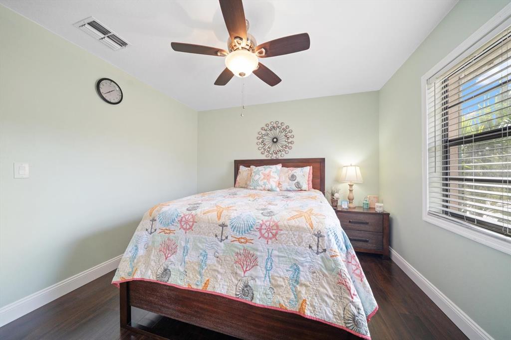 2131 Ridge Road South, Unit 75 Largo, FL 33778 - Photo 21 of 32 a bedroom with a bed and a window
