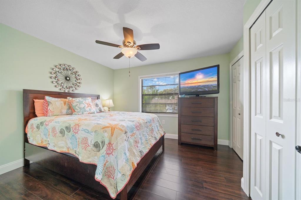 2131 Ridge Road South, Unit 75 Largo, FL 33778 - Photo 22 of 32 a bedroom with a bed a dresser and a window