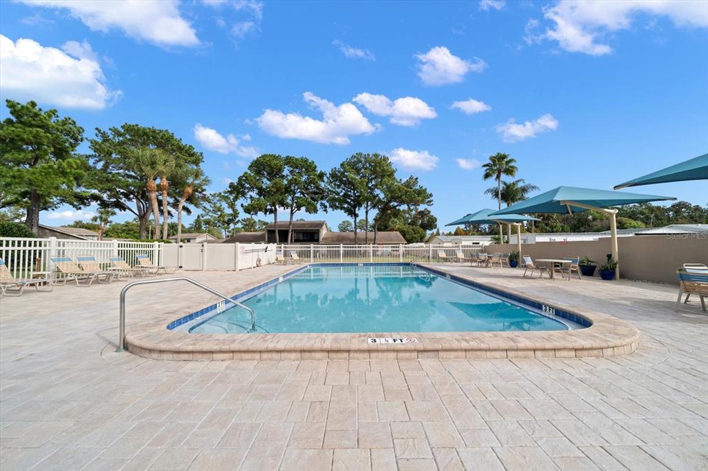 2131 Ridge Road South, Unit 75 Largo, FL 33778 - Photo 26 of 32 a view of a swimming pool with a patio