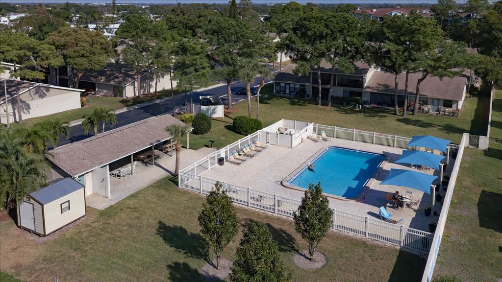 2131 Ridge Road South, Unit 75 Largo, FL 33778 - Photo 29 of 32 an aerial view of a house with garden space and patio