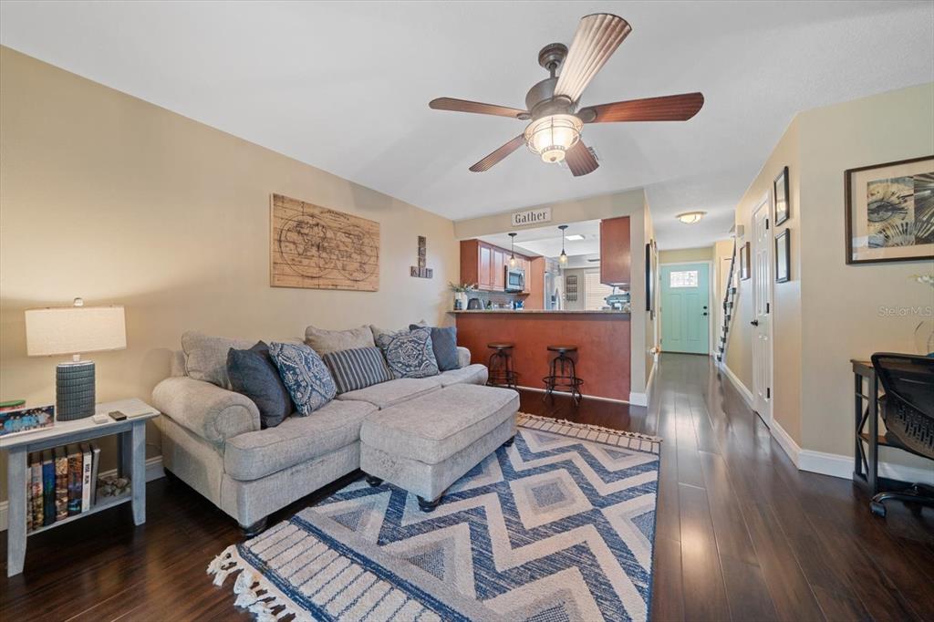 2131 Ridge Road South, Unit 75 Largo, FL 33778 - Photo 7 of 32 a living room with furniture and wooden floor