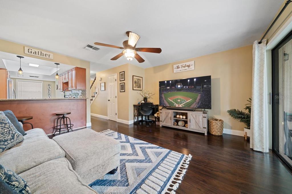 2131 Ridge Road South, Unit 75 Largo, FL 33778 - Photo 8 of 32 a living room with furniture and a flat screen tv