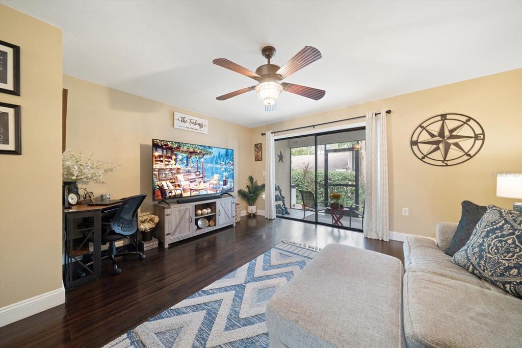 2131 Ridge Road South, Unit 75 Largo, FL 33778 - Photo 10 of 32 a living room with furniture and a flat screen tv