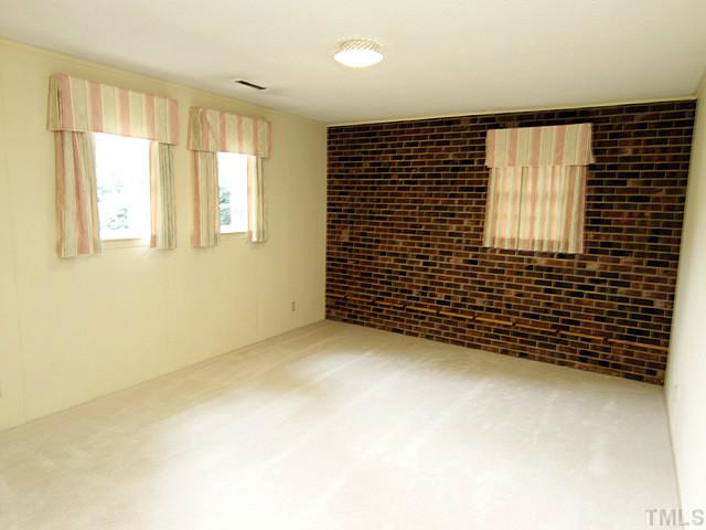 2213 Myron Drive Raleigh, NC 27607 - Photo 8 of 20 a view of an empty room with a window