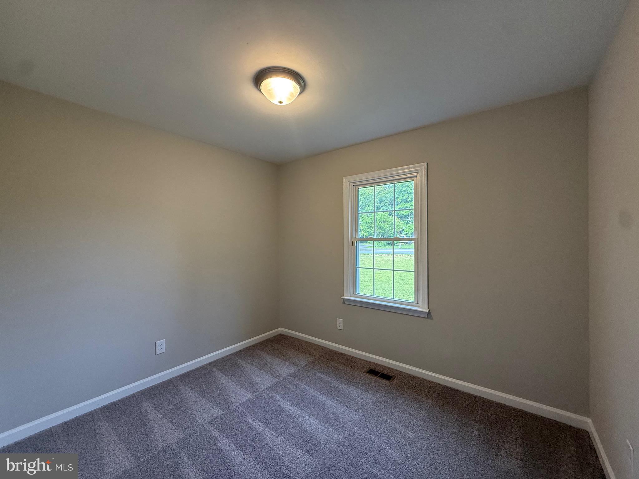 319 Chopping Road Mineral, VA 23117 - Photo 18 of 22 an empty room with a window