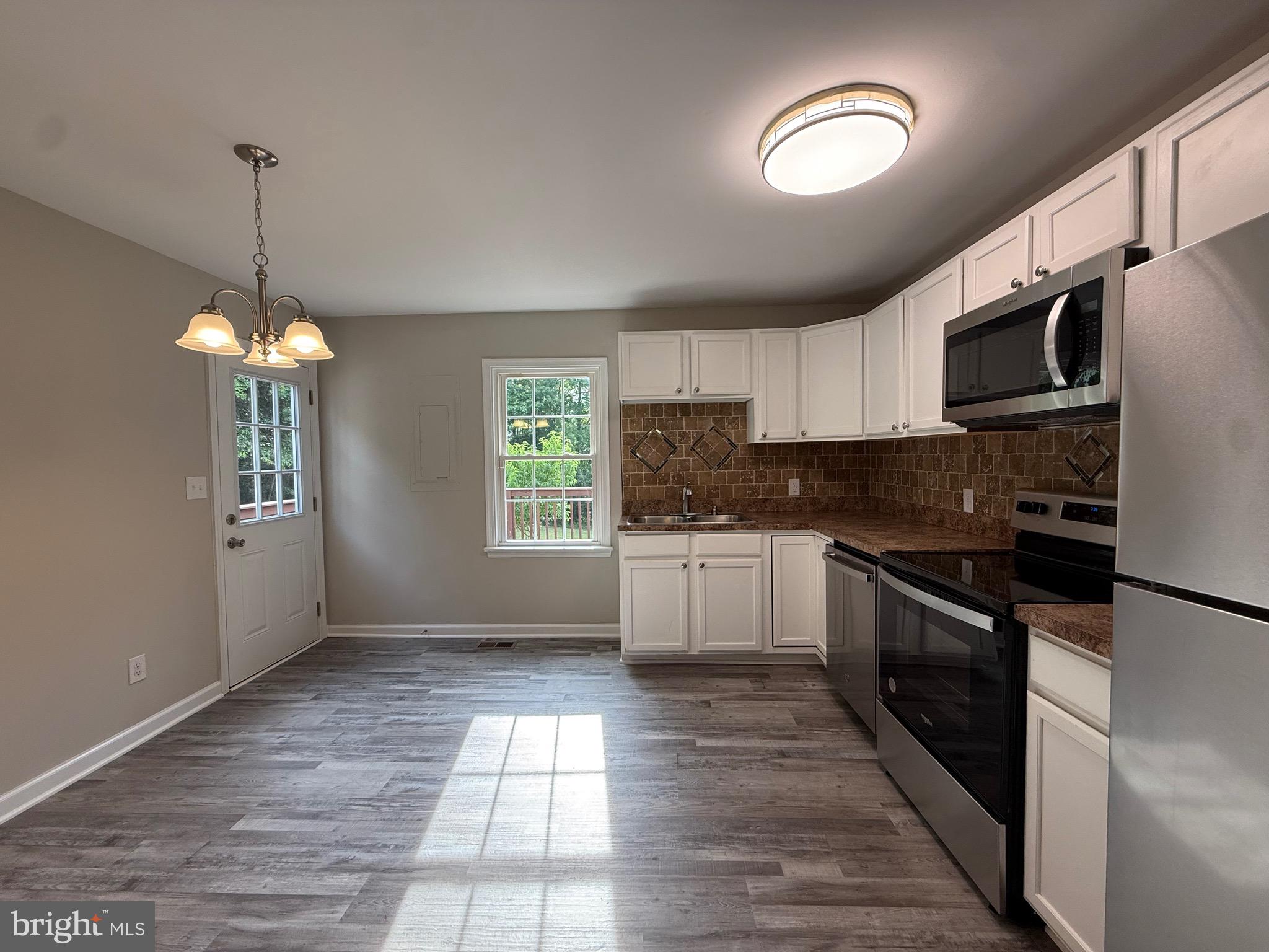 319 Chopping Road Mineral, VA 23117 - Photo 6 of 22 a kitchen with stainless steel appliances granite countertop a stove a sink dishwasher a refrigerator and a stove