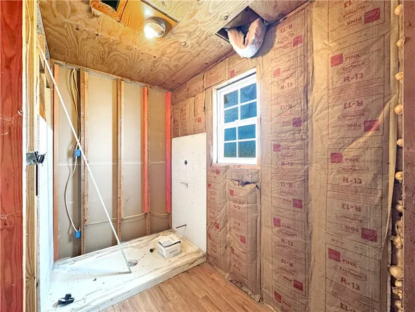 a bathroom with a bathtub and shower