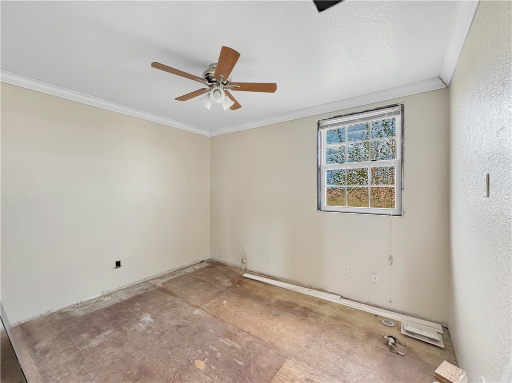 2977 Jurica Road Corpus Christi, TX 78415 - Photo 15 of 40 a view of a room with a ceiling fan and window