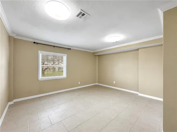 a large kitchen with cabinets and stainless steel appliances