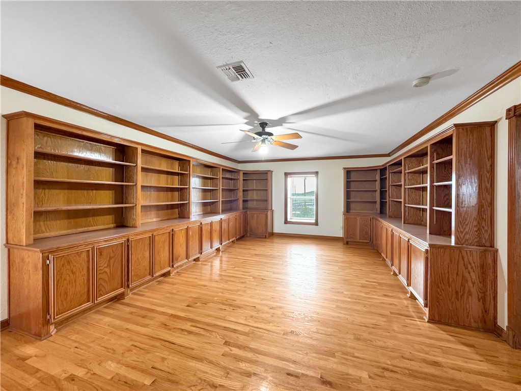 2977 Jurica Road Corpus Christi, TX 78415 - Photo 29 of 40 a view of an empty room with wooden floor and a window