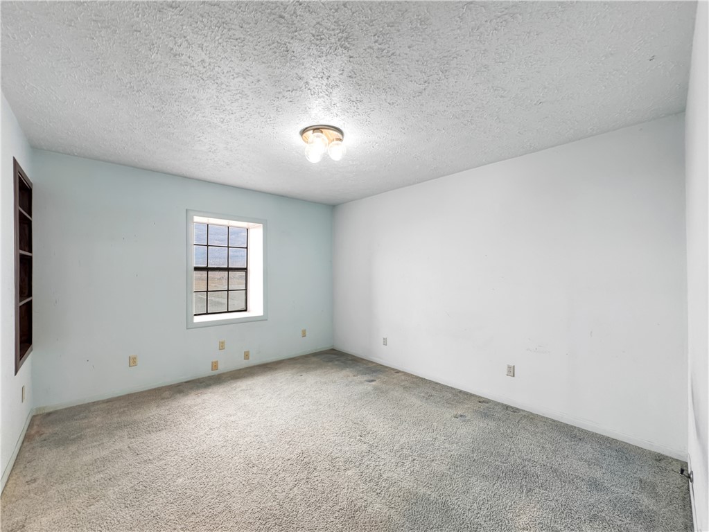 2977 Jurica Road Corpus Christi, TX 78415 - Photo 31 of 40 an empty room with a window