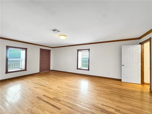 a bathroom with a toilet sink and shower
