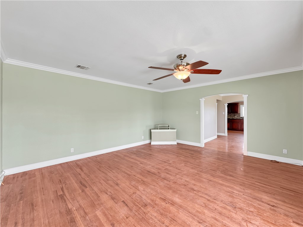 2977 Jurica Road Corpus Christi, TX 78415 - Photo 5 of 40 a view of an empty room with wooden floor