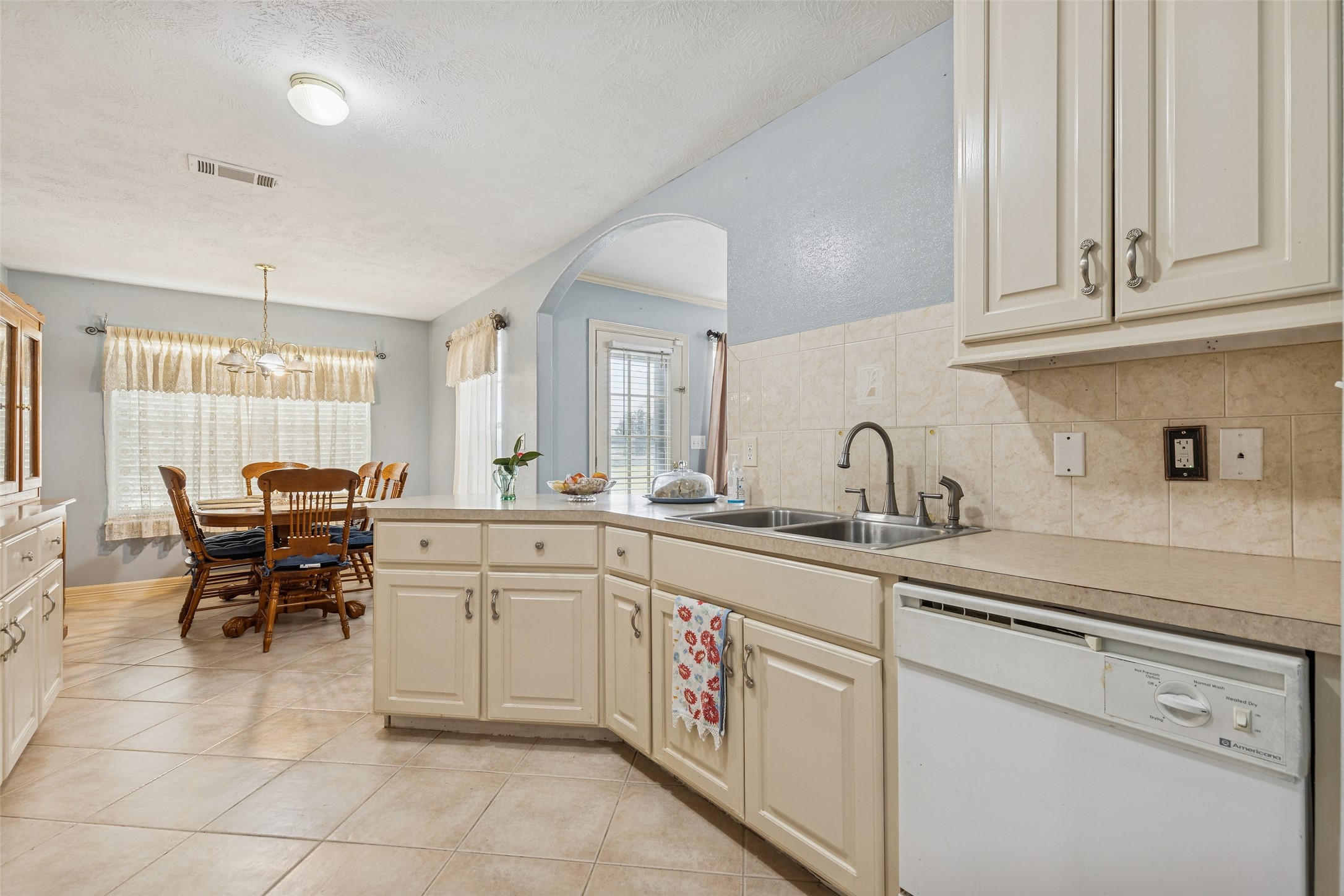 21 Pine Prairie School Road Huntsville, TX 77320 - Photo 12 of 26 a kitchen with sink and white cabinets