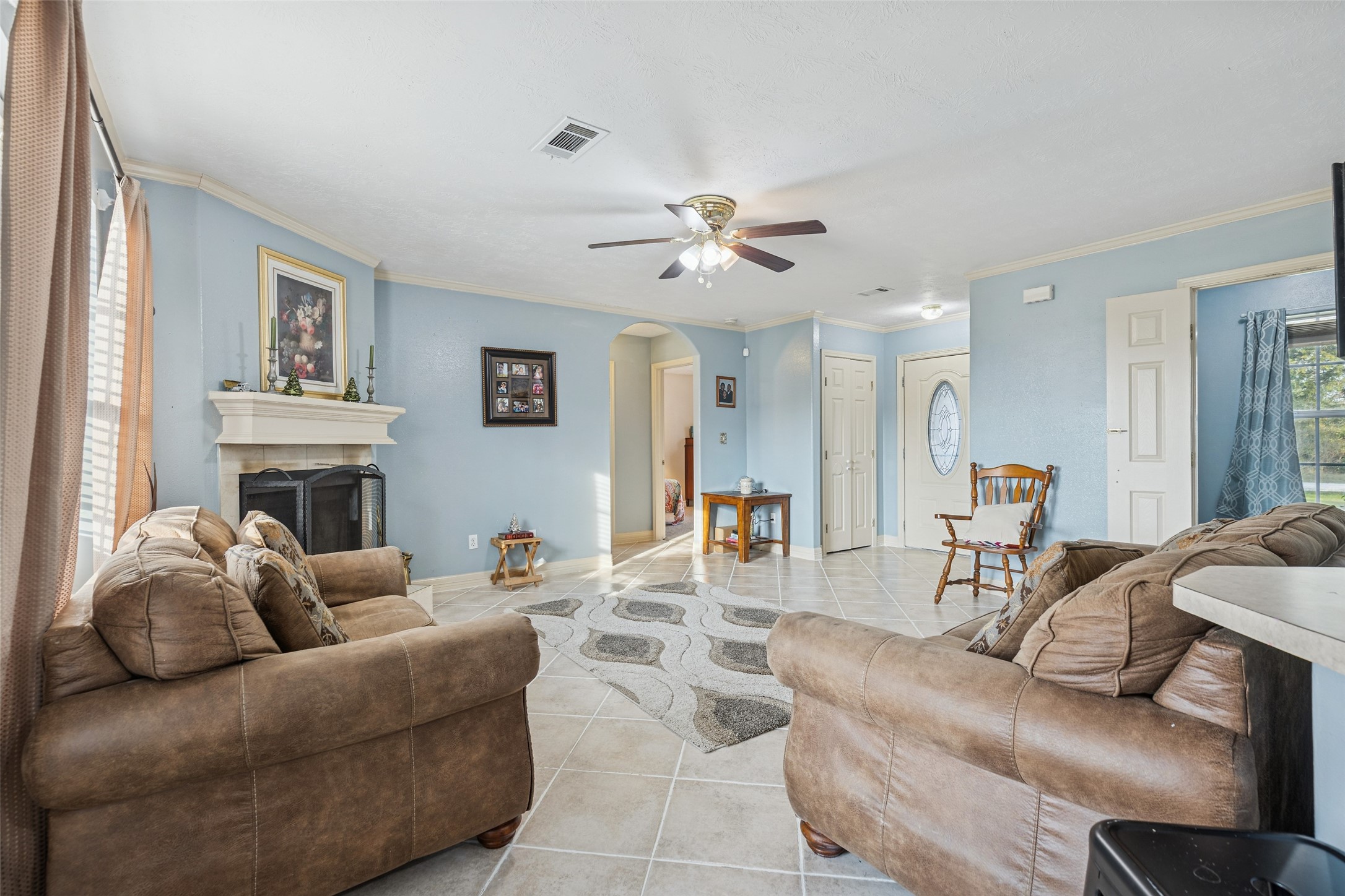 21 Pine Prairie School Road Huntsville, TX 77320 - Photo 6 of 26 a living room with furniture a fireplace and a window