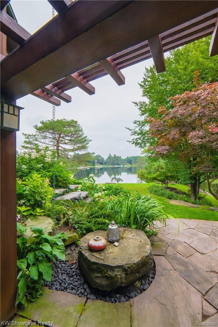 1110 Seneca Road Lake Orion, MI 48362 - Photo 42 of 50 Lower Level Walk-out Patio with Gristmill Fountain