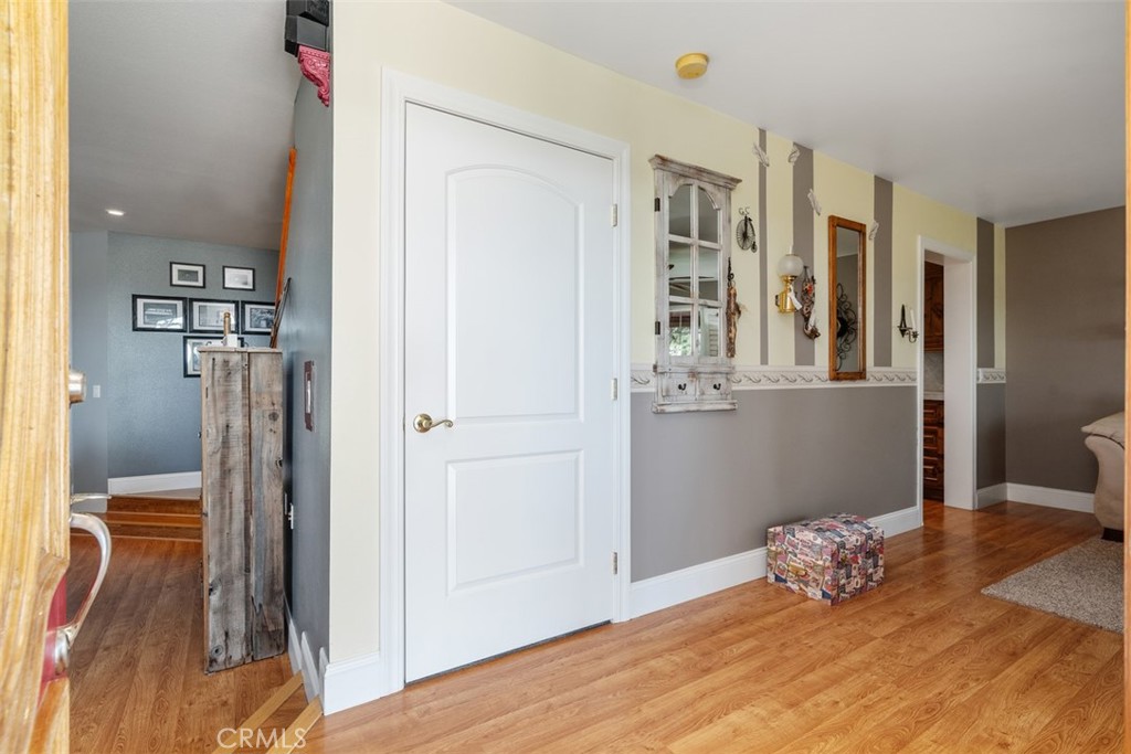 39460 Hilt Road Temecula, CA 92591 - Photo 13 of 74 a bedroom with a bed and wooden floor