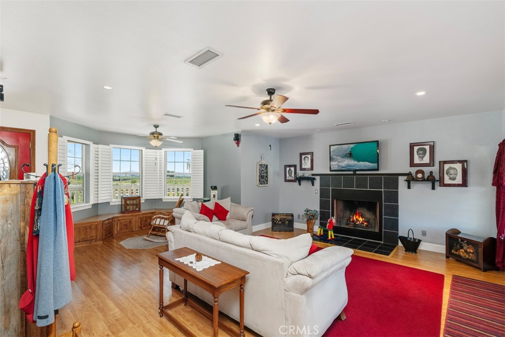 39460 Hilt Road Temecula, CA 92591 - Photo 16 of 74 a living room with furniture fireplace and flat screen tv
