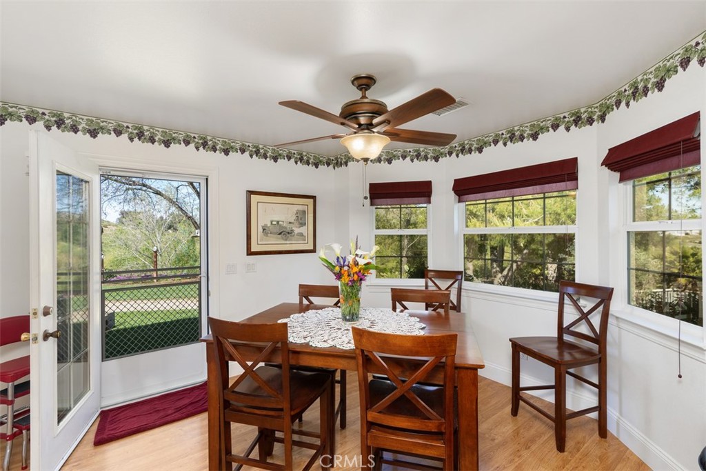 39460 Hilt Road Temecula, CA 92591 - Photo 22 of 74 a dining room with furniture a rug and a large window