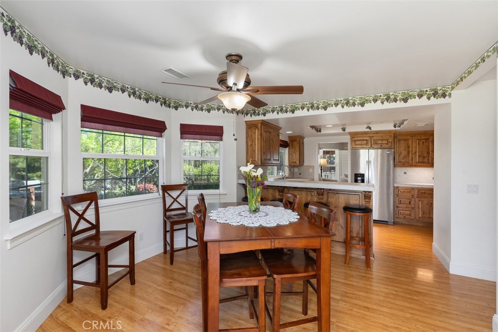 39460 Hilt Road Temecula, CA 92591 - Photo 23 of 74 a view of a dining room with furniture window and wooden floor