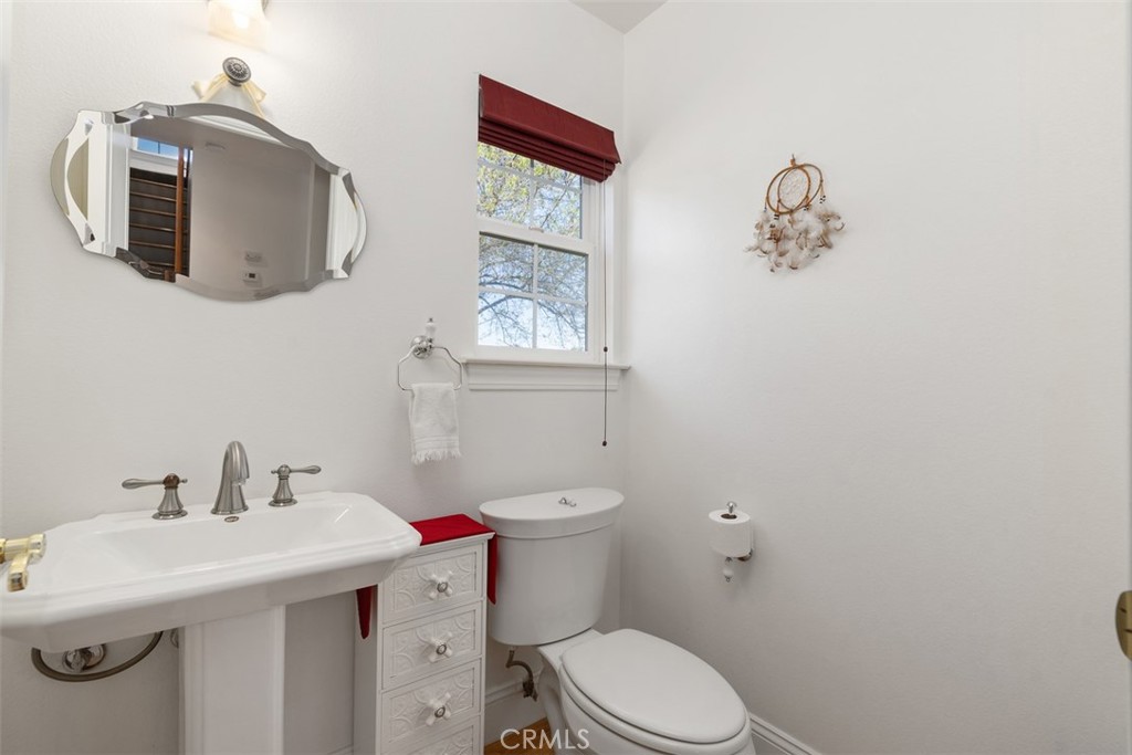 39460 Hilt Road Temecula, CA 92591 - Photo 26 of 74 a bathroom with a sink mirror and toilet