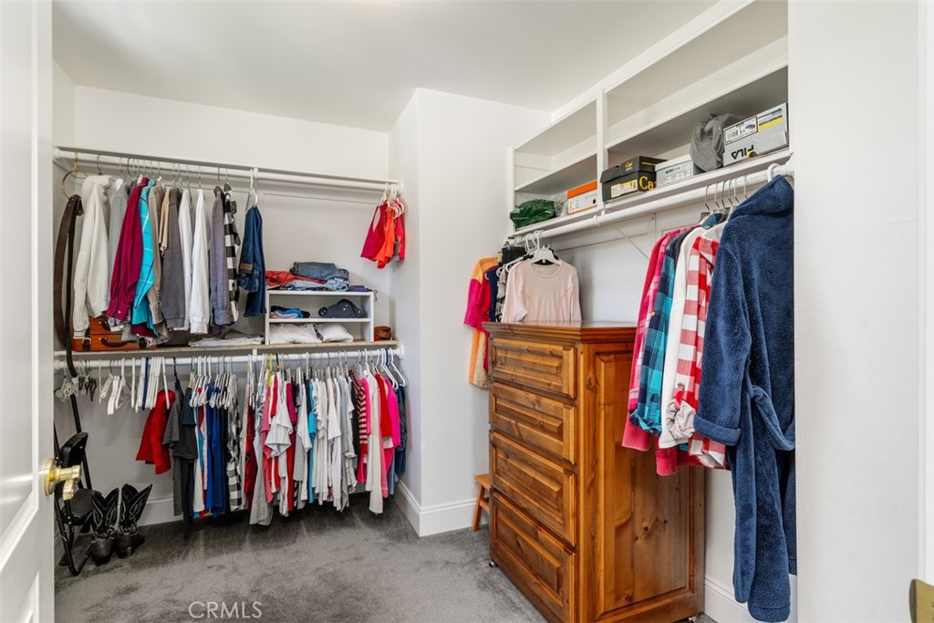 39460 Hilt Road Temecula, CA 92591 - Photo 37 of 74 a view of walk in closet with clothes