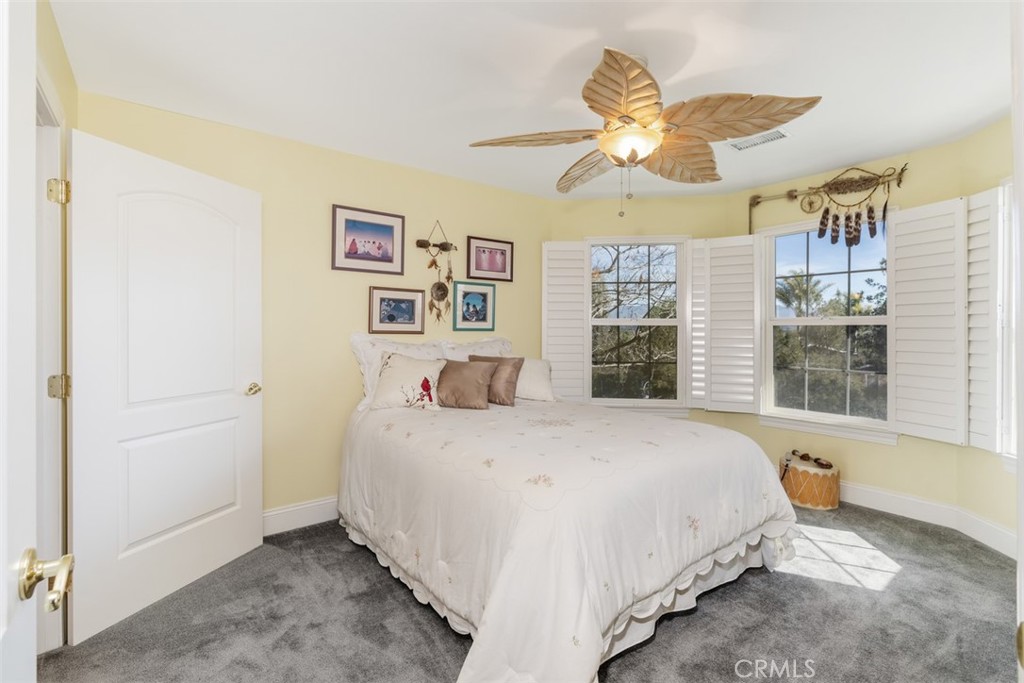39460 Hilt Road Temecula, CA 92591 - Photo 38 of 74 a bedroom with a bed and a large window