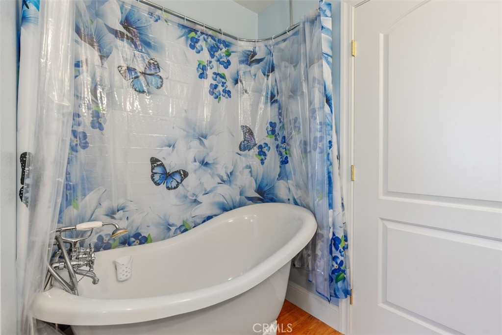 39460 Hilt Road Temecula, CA 92591 - Photo 40 of 74 a bathroom with a bathtub and shower