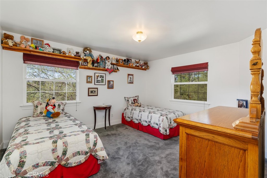 39460 Hilt Road Temecula, CA 92591 - Photo 41 of 74 a bedroom with bed and a window