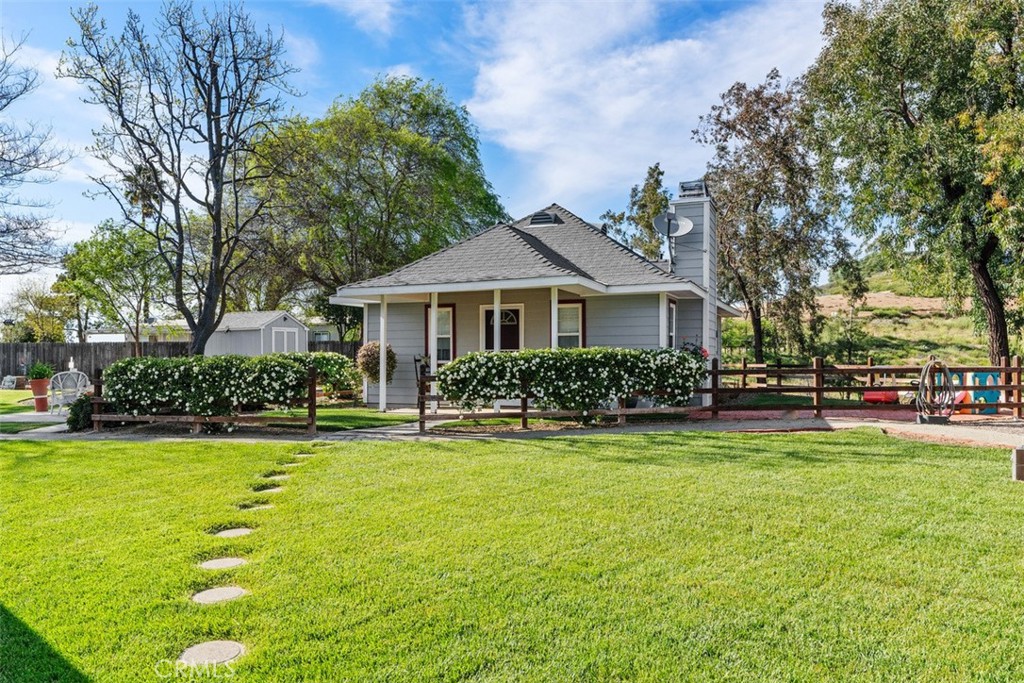 39460 Hilt Road Temecula, CA 92591 - Photo 55 of 74 a front view of a house with a yard