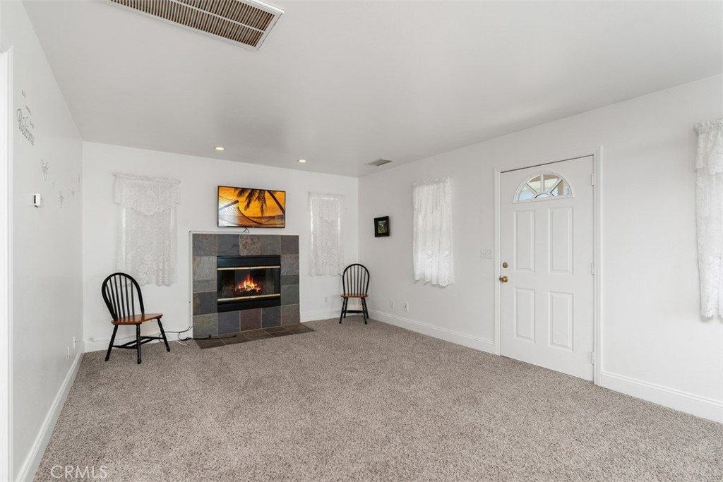 39460 Hilt Road Temecula, CA 92591 - Photo 57 of 74 a living room with furniture and a fireplace