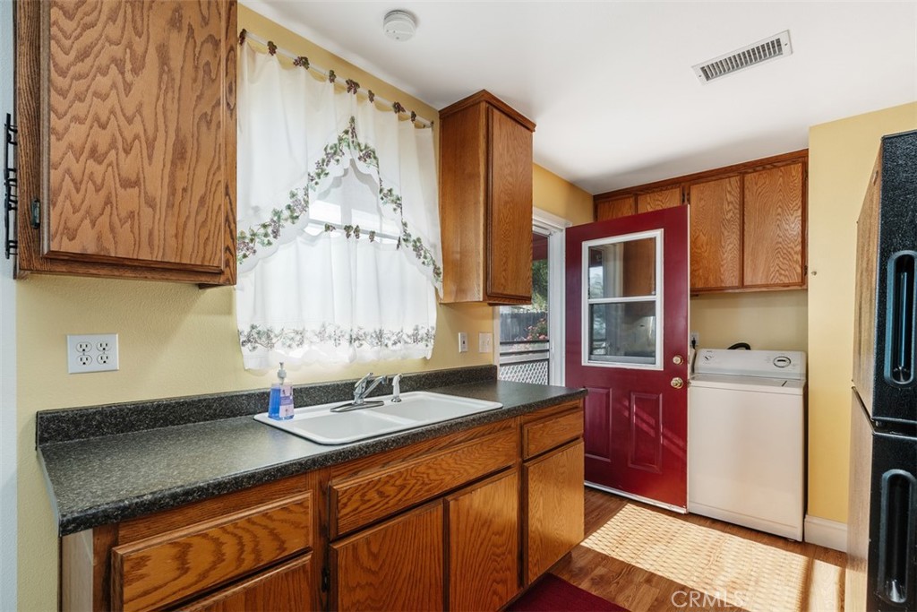 39460 Hilt Road Temecula, CA 92591 - Photo 59 of 74 a kitchen with stainless steel appliances granite countertop a sink and a cabinets